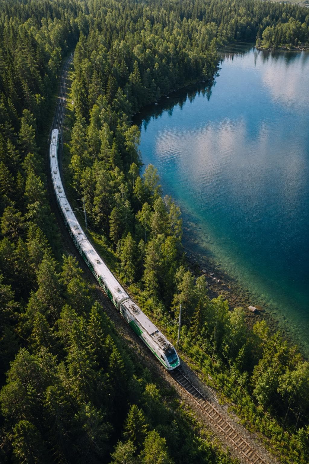 Train beside a Finnish lake and forest